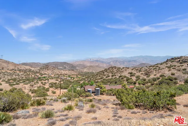 a view of a city with mountains in the background