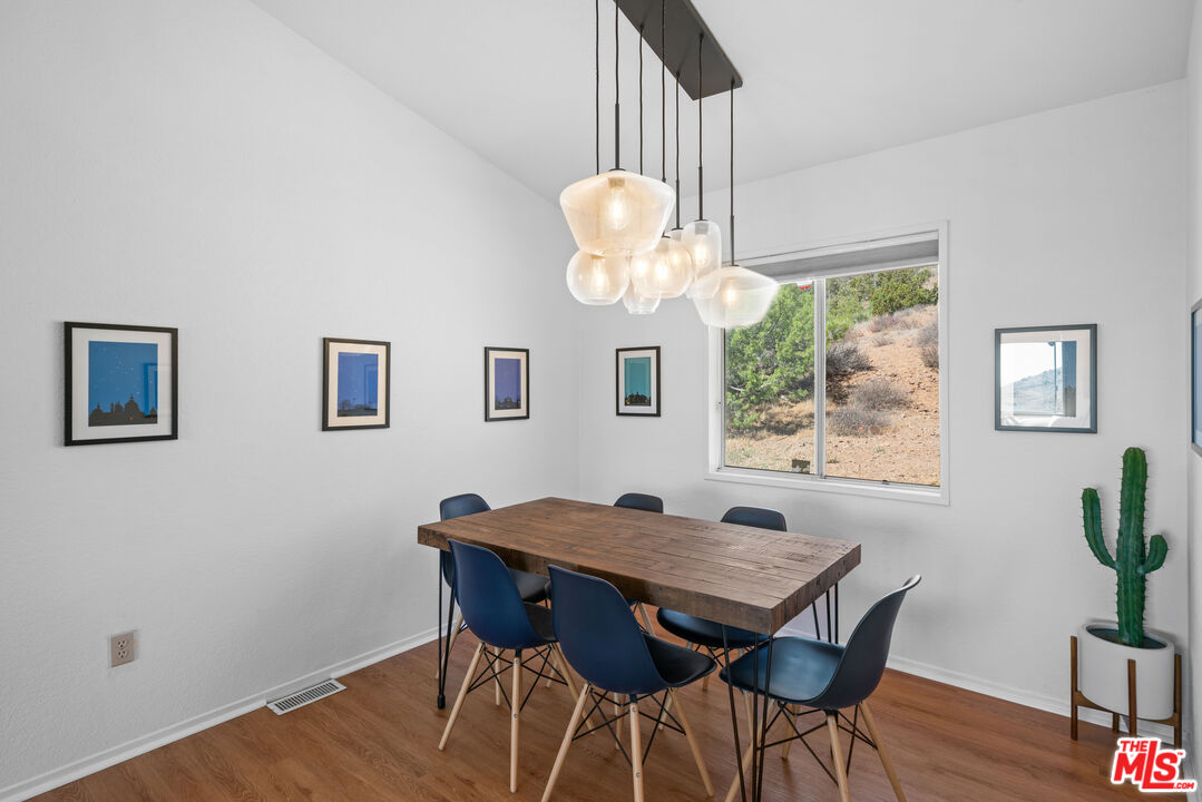 1794 Rebel Road Acton, CA 93551 - Photo 5 of 36 a view of a dining room with furniture window and wooden floor