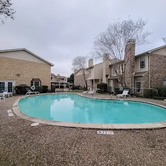 a view of a house with a swimming pool
