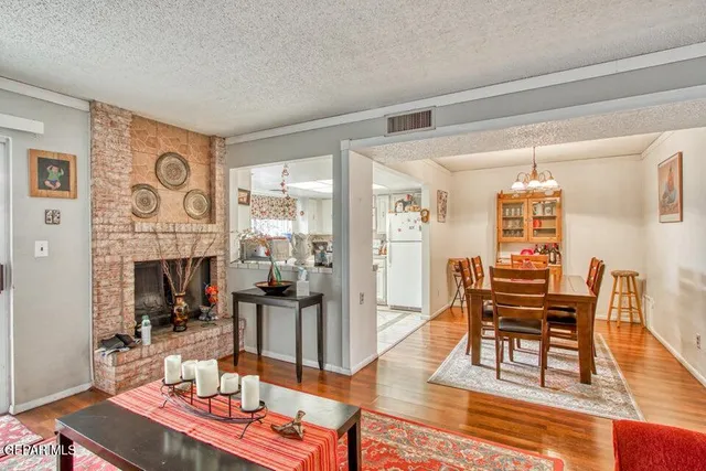 a living room with fireplace furniture and a window