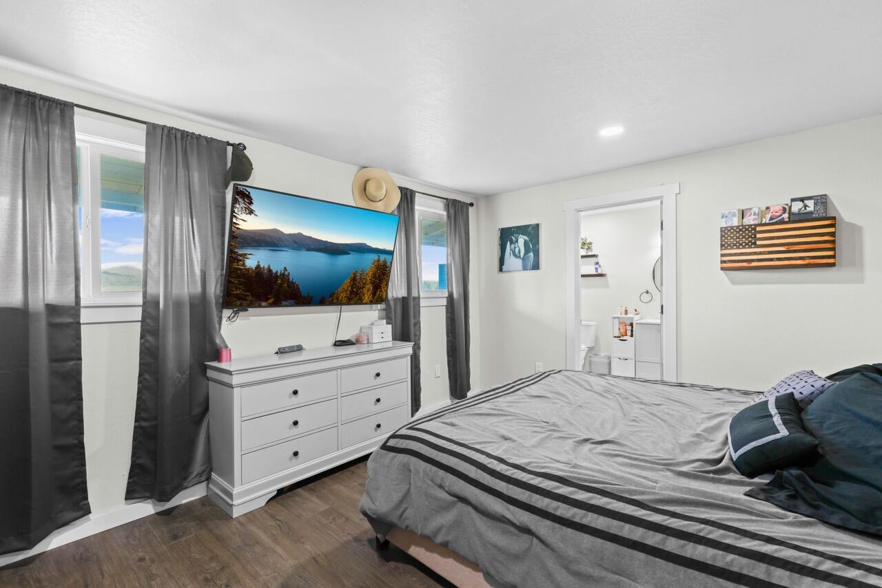 380 Greenleaf Drive Eagle Point, OR 97524 - Photo 21 of 31 a bedroom with a bed and a flat screen tv