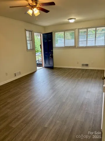 a view of a kitchen with a sink and cabinets