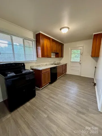 a spacious bathroom with a granite countertop sink and a dishwasher