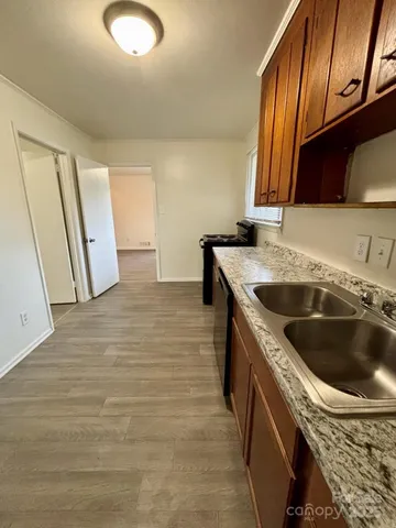 wooden floor in a hall with wooden floor and stairs