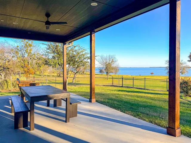 a view of a porch with furniture and yard