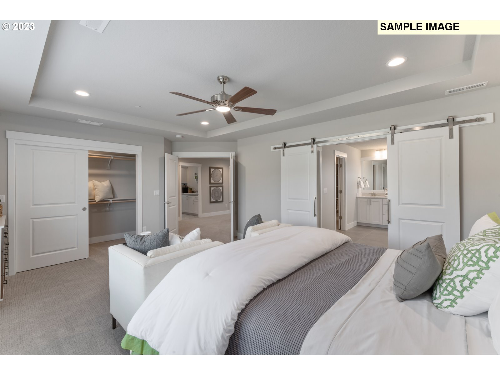 5597 North 94th Avenue, Unit LT246 Camas, WA 98607 - Photo 14 of 32 a bedroom with a large bed and ceiling fan