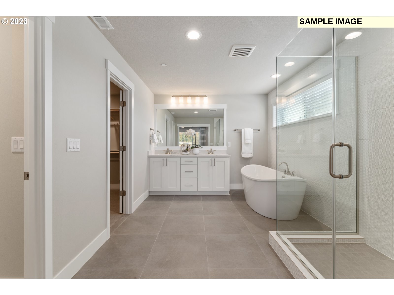 5597 North 94th Avenue, Unit LT246 Camas, WA 98607 - Photo 15 of 32 a open kitchen with white cabinets and wooden floor