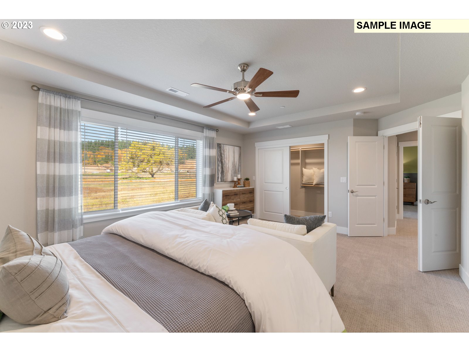 5597 North 94th Avenue, Unit LT246 Camas, WA 98607 - Photo 17 of 32 a bedroom with a bed and a large window