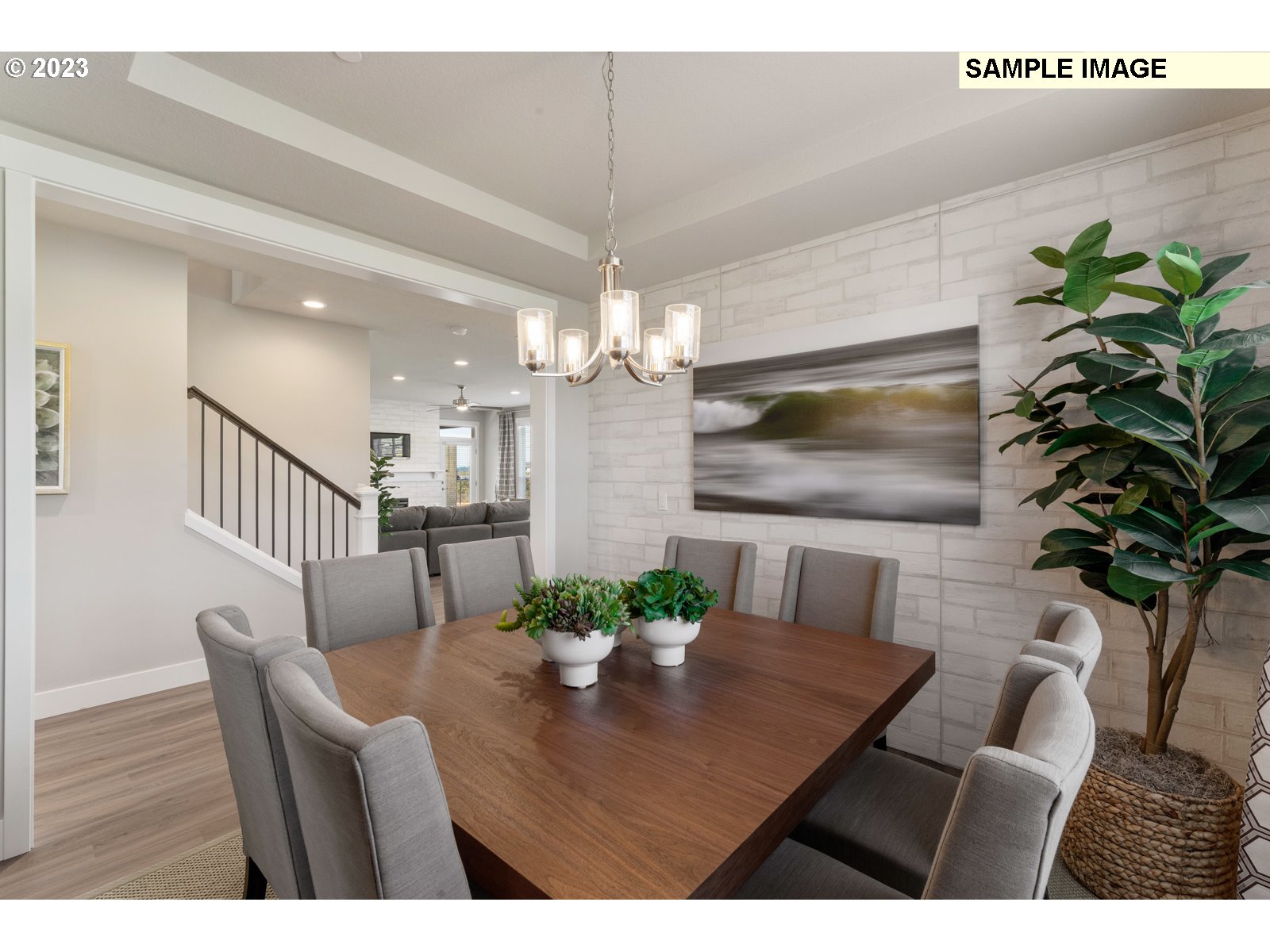 5597 North 94th Avenue, Unit LT246 Camas, WA 98607 - Photo 18 of 32 a view of a dining room with furniture a chandelier and wooden floor
