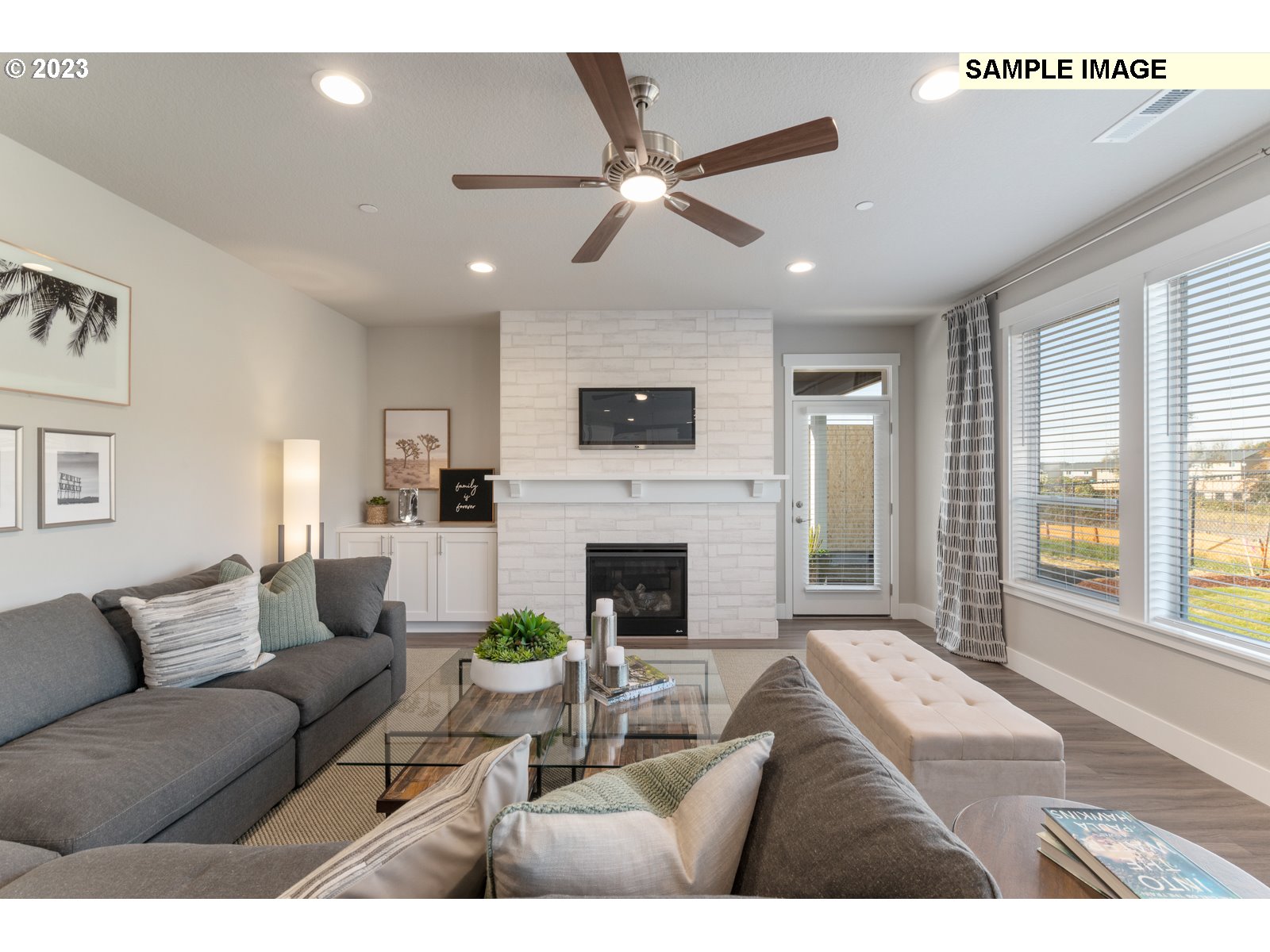 5597 North 94th Avenue, Unit LT246 Camas, WA 98607 - Photo 19 of 32 a living room with furniture large window and a fireplace