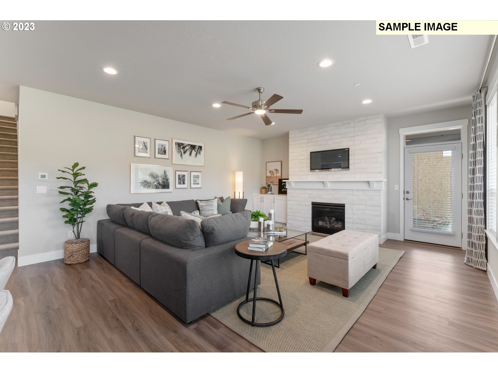 5597 North 94th Avenue, Unit LT246 Camas, WA 98607 - Photo 21 of 32 a living room with furniture a fireplace and a potted plant