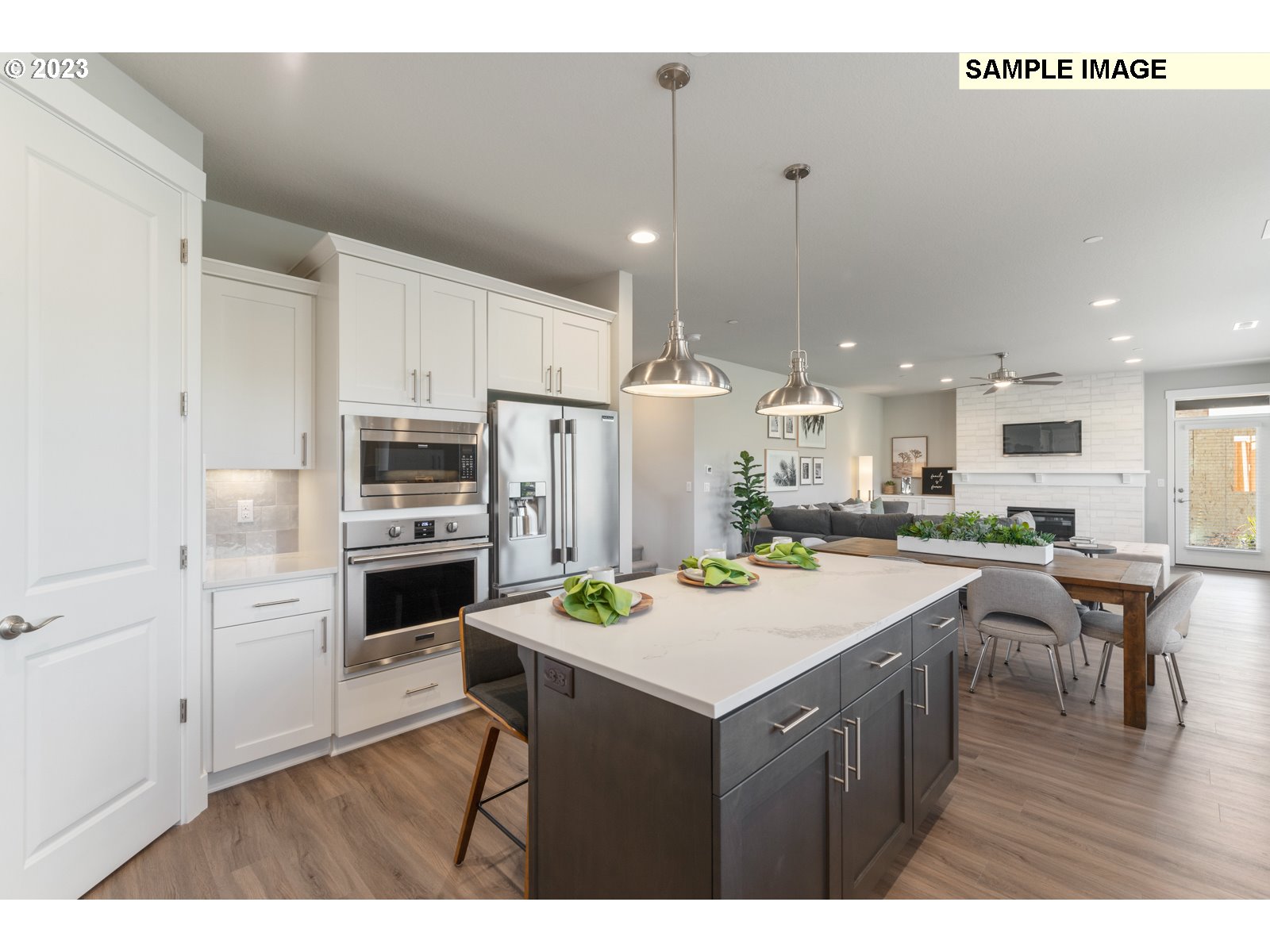 5597 North 94th Avenue, Unit LT246 Camas, WA 98607 - Photo 4 of 32 a kitchen with kitchen island a sink stove and refrigerator