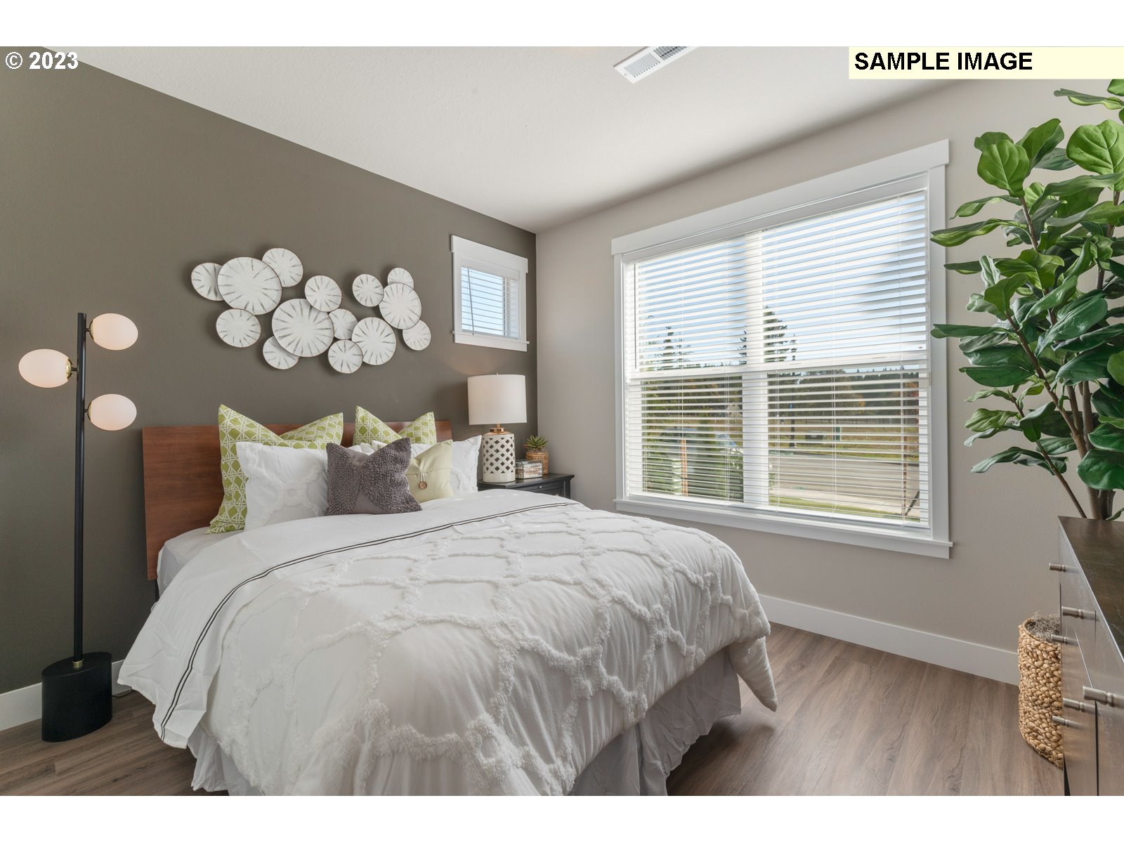 5597 North 94th Avenue, Unit LT246 Camas, WA 98607 - Photo 6 of 32 a large bed sitting in a bedroom next to a window