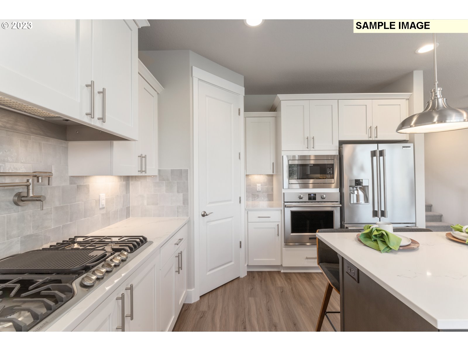5597 North 94th Avenue, Unit LT246 Camas, WA 98607 - Photo 7 of 32 a kitchen with cabinets and stainless steel appliances