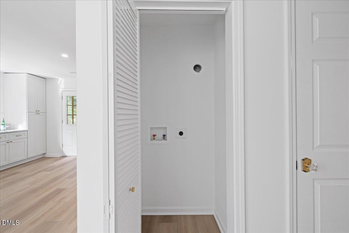 809 Felicia Street Durham, NC 27704 - Photo 13 of 31 a view of a hallway with wooden floor