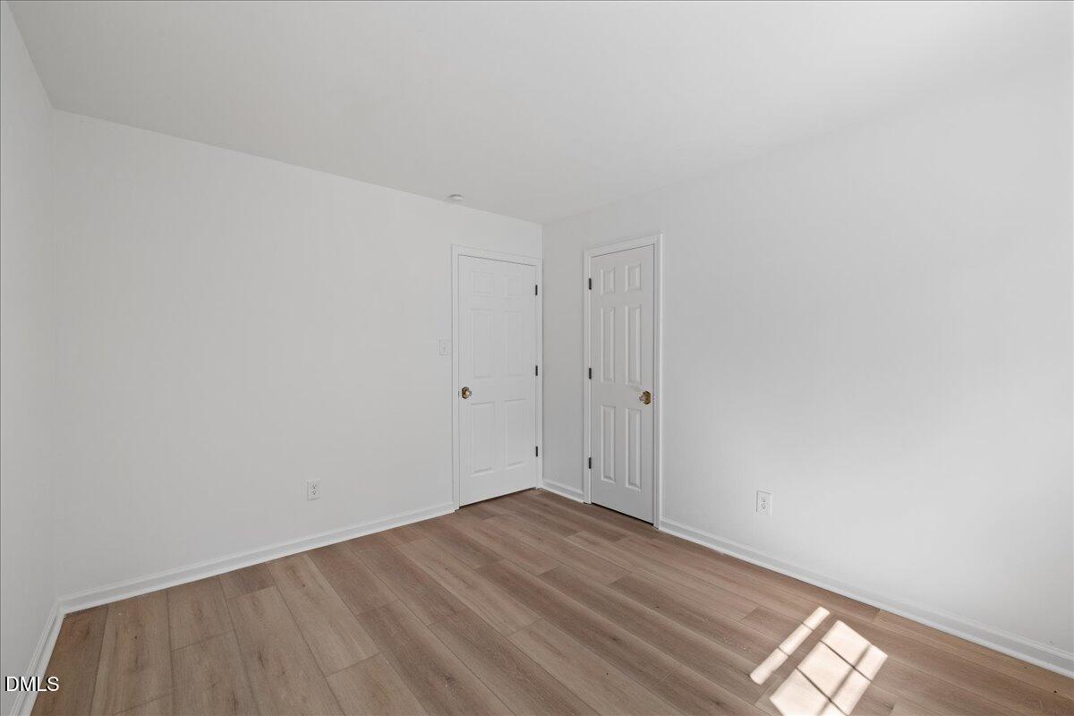 809 Felicia Street Durham, NC 27704 - Photo 15 of 31 a view of empty room with wooden floor
