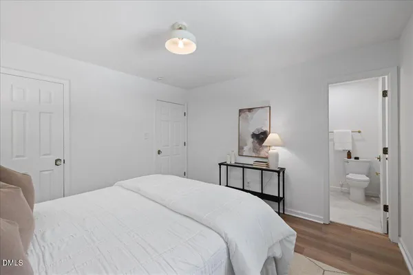 a bedroom with a bed and a chair