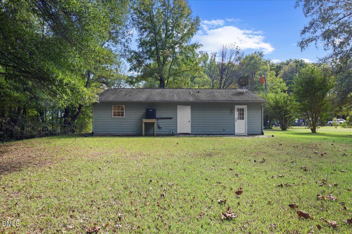 809 Felicia Street Durham, NC 27704 - Photo 27 of 31 a backyard of a house with lots of green space