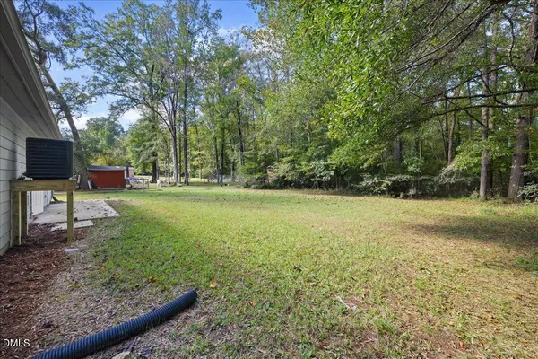 a backyard of a house with lots of green space