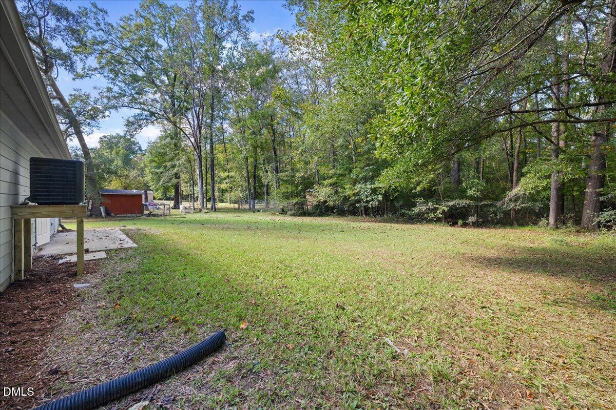 809 Felicia Street Durham, NC 27704 - Photo 28 of 31 a view of outdoor space with deck and yard
