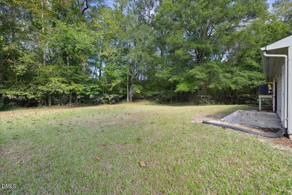 a view of outdoor space with deck and yard