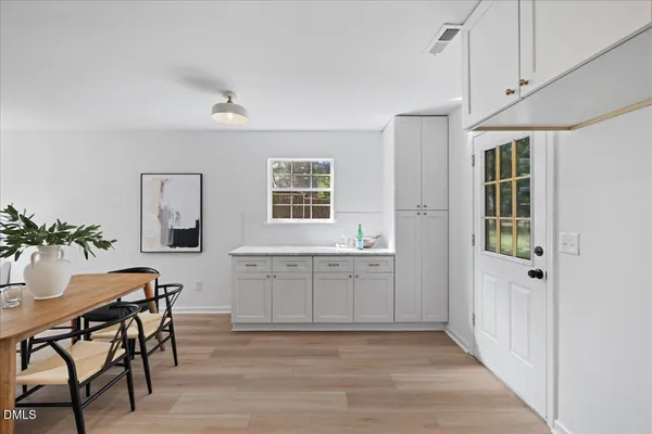 a view of a dining room with furniture and window