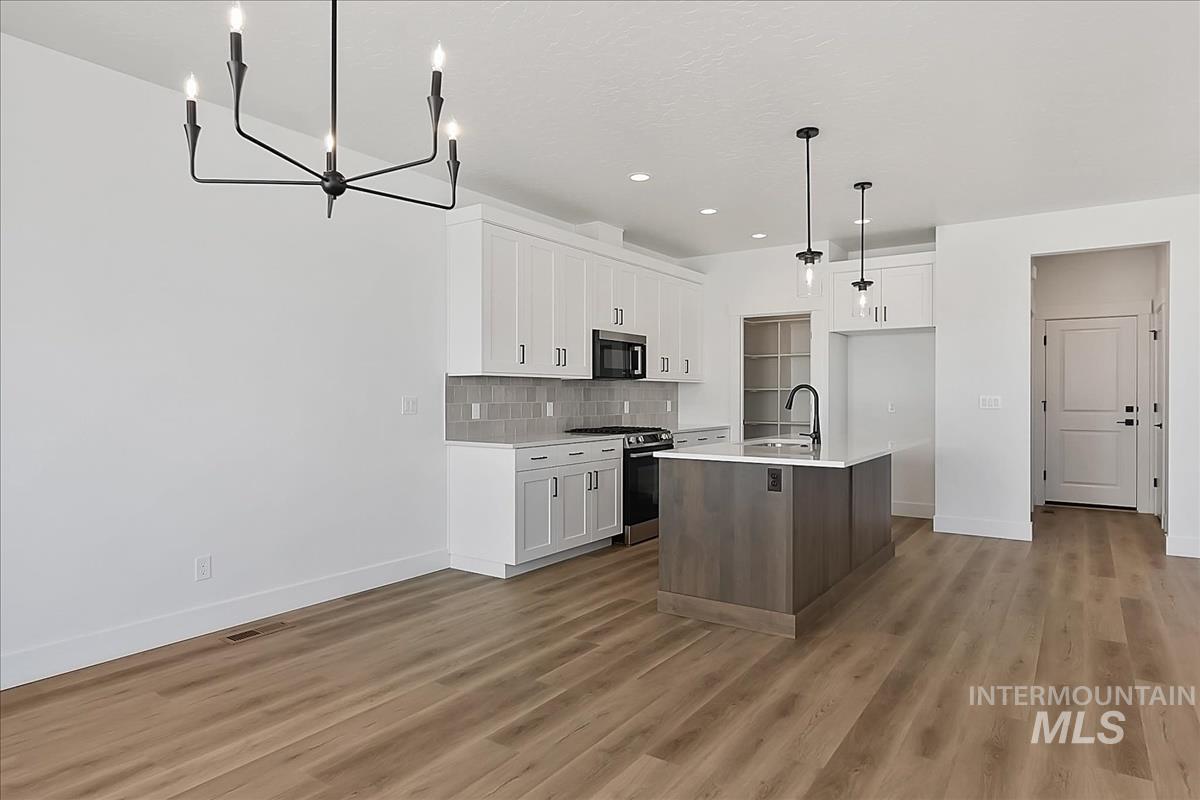 776 South Calhoun Lane Star, ID 83669 - Photo 15 of 49 Open-concept living space featuring wood-finish flooring