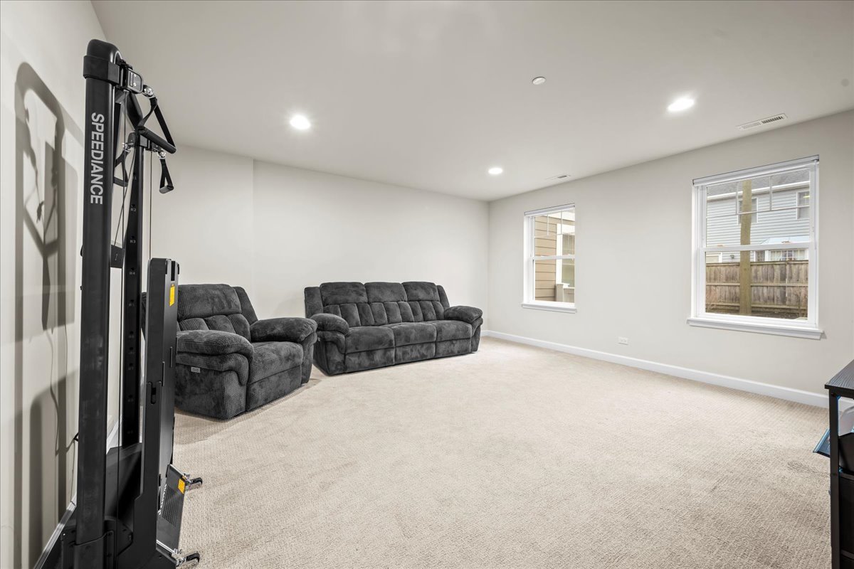 834 Chestnut Street Deerfield, IL 60015 - Photo 13 of 22 a living room with furniture a flat screen tv and a window