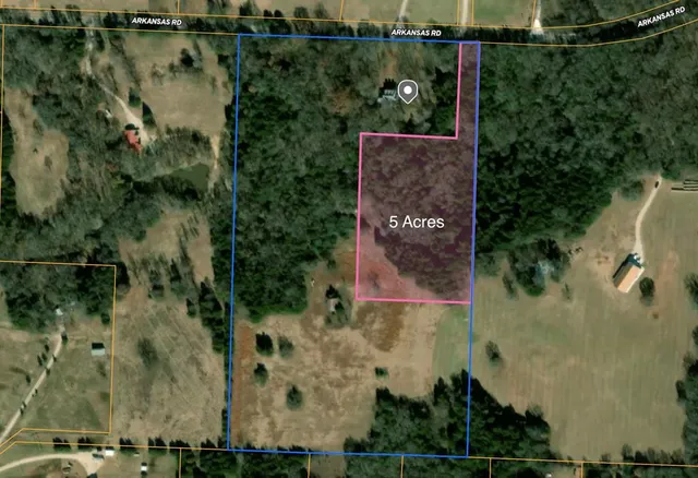 an aerial view of house with yard swimming pool and outdoor seating