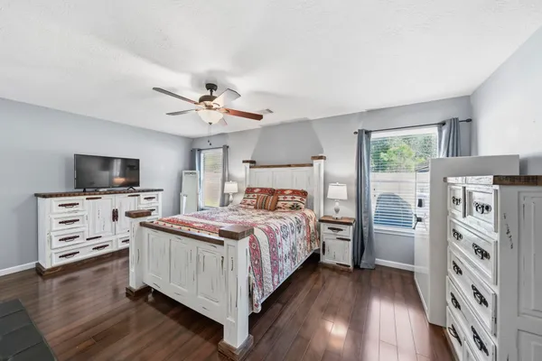 a bed room with a bed and a tv