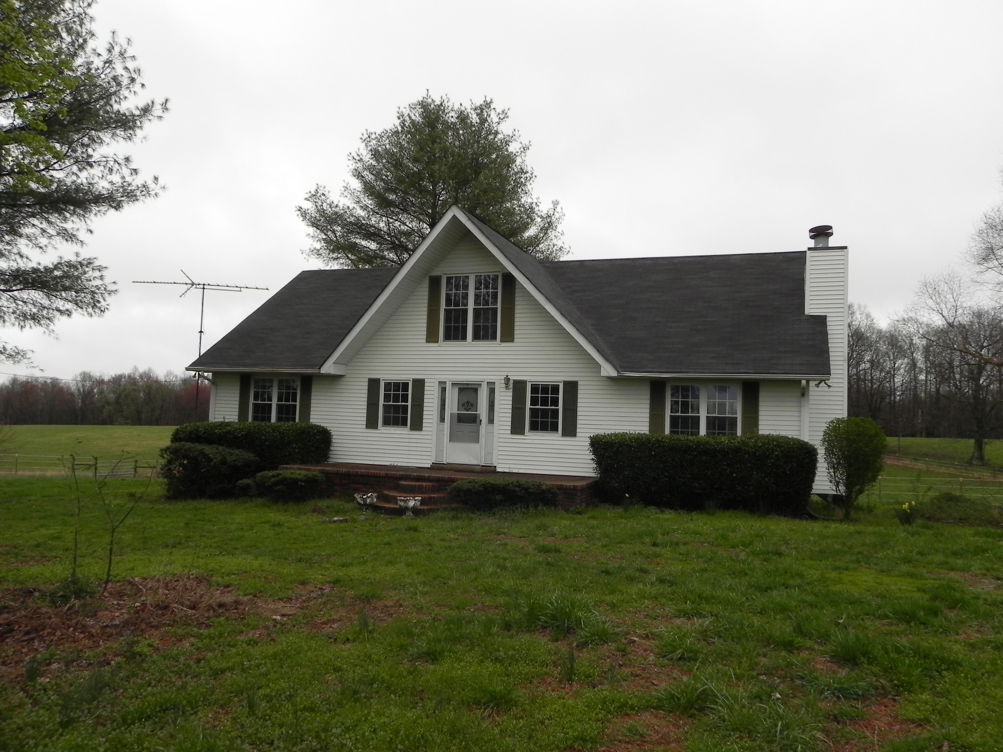 444 Nixon Road Red Boiling Springs, TN 37150 - Photo 1 of 41 a front view of a house with a garden