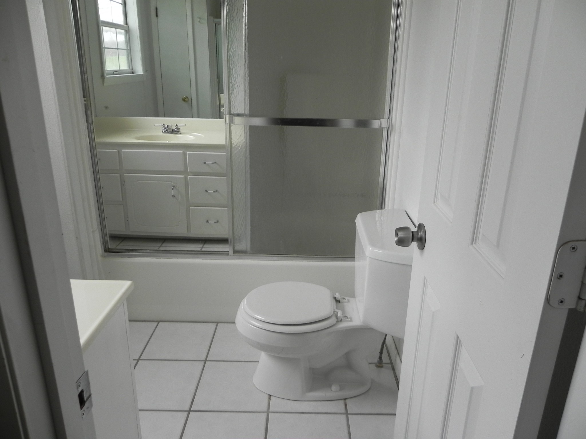444 Nixon Road Red Boiling Springs, TN 37150 - Photo 14 of 41 a bathroom with a sink a toilet and shower
