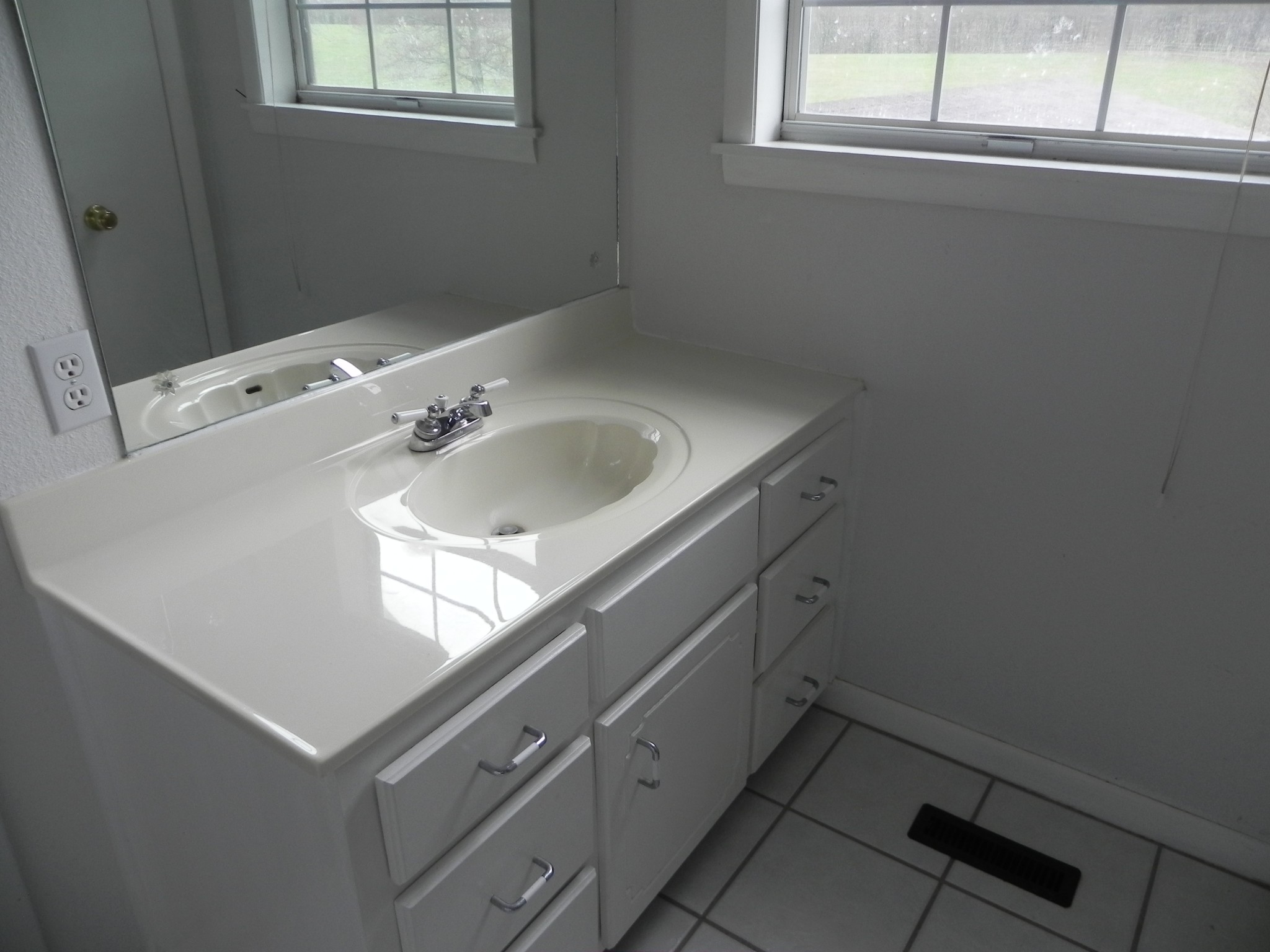 444 Nixon Road Red Boiling Springs, TN 37150 - Photo 15 of 41 a bathroom with a sink and a window