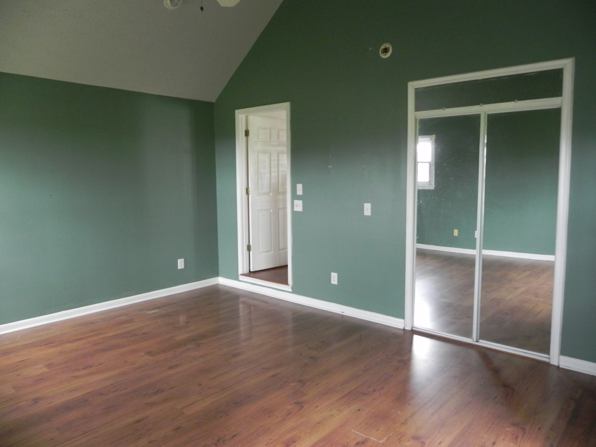 444 Nixon Road Red Boiling Springs, TN 37150 - Photo 20 of 41 an empty room with wooden floor and closet