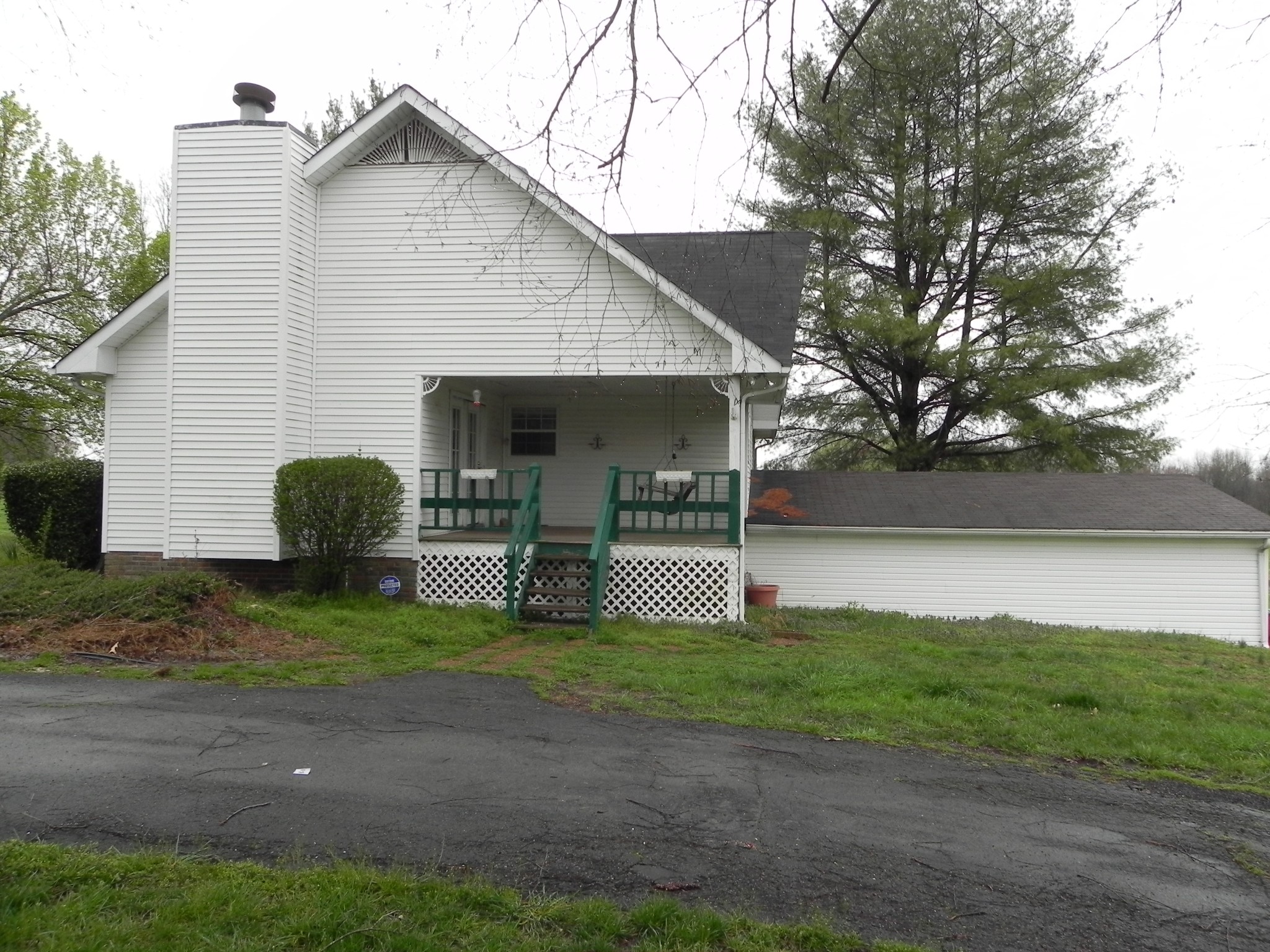 444 Nixon Road Red Boiling Springs, TN 37150 - Photo 2 of 41 a view of a house with backyard and garden