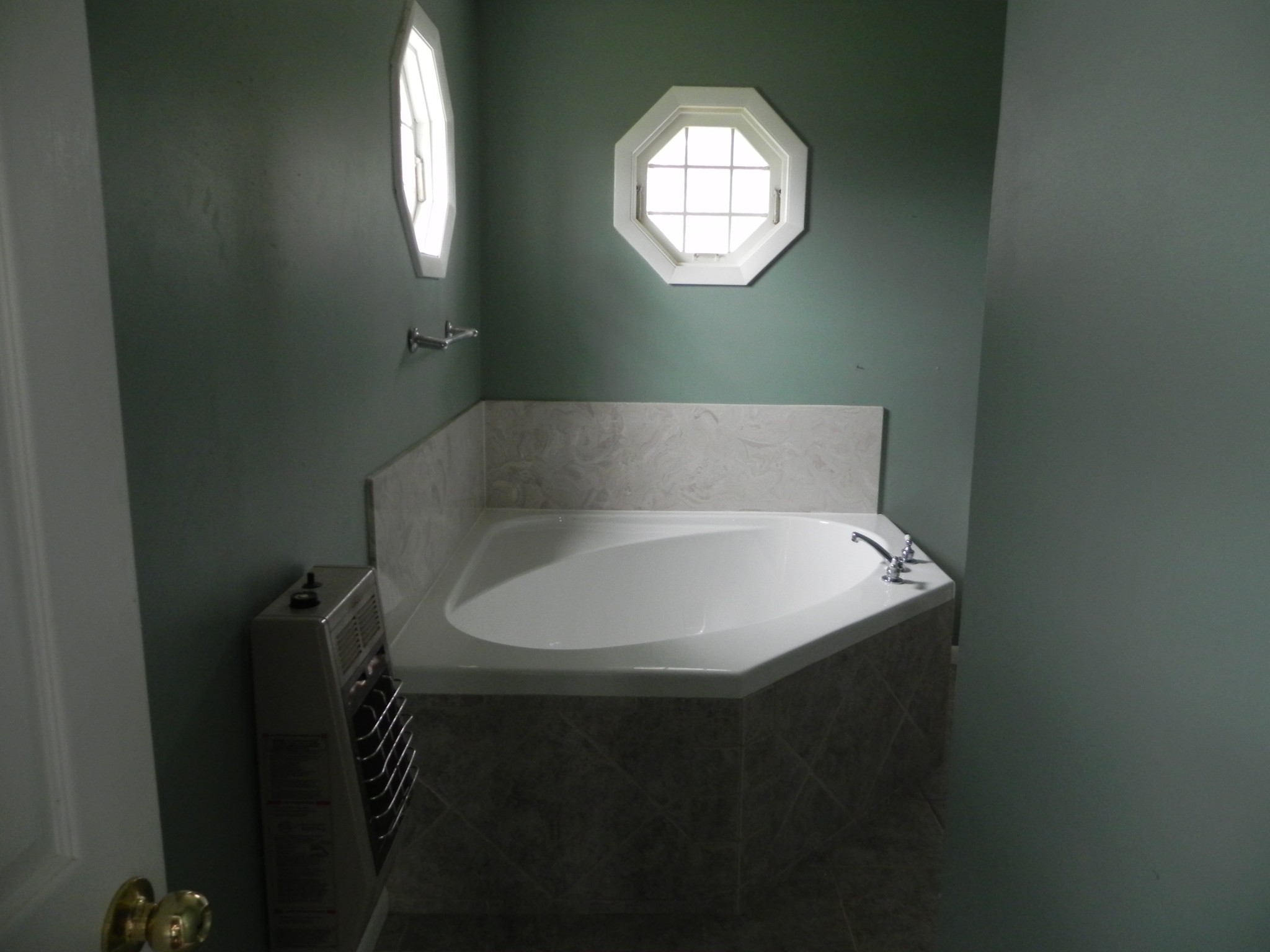 444 Nixon Road Red Boiling Springs, TN 37150 - Photo 22 of 41 a white bath tub sitting in a bathroom