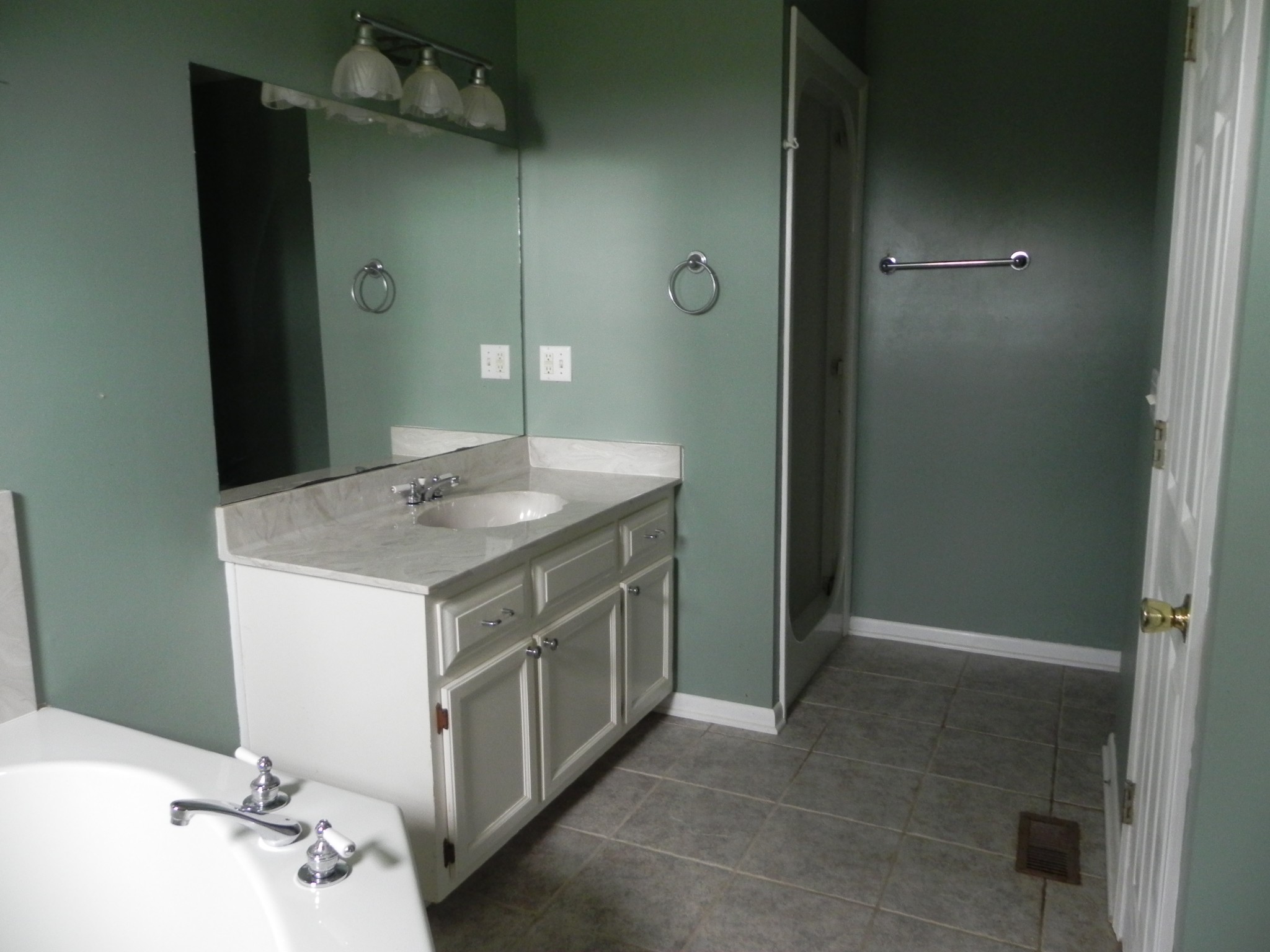 444 Nixon Road Red Boiling Springs, TN 37150 - Photo 23 of 41 a bathroom with a granite countertop sink and a mirror
