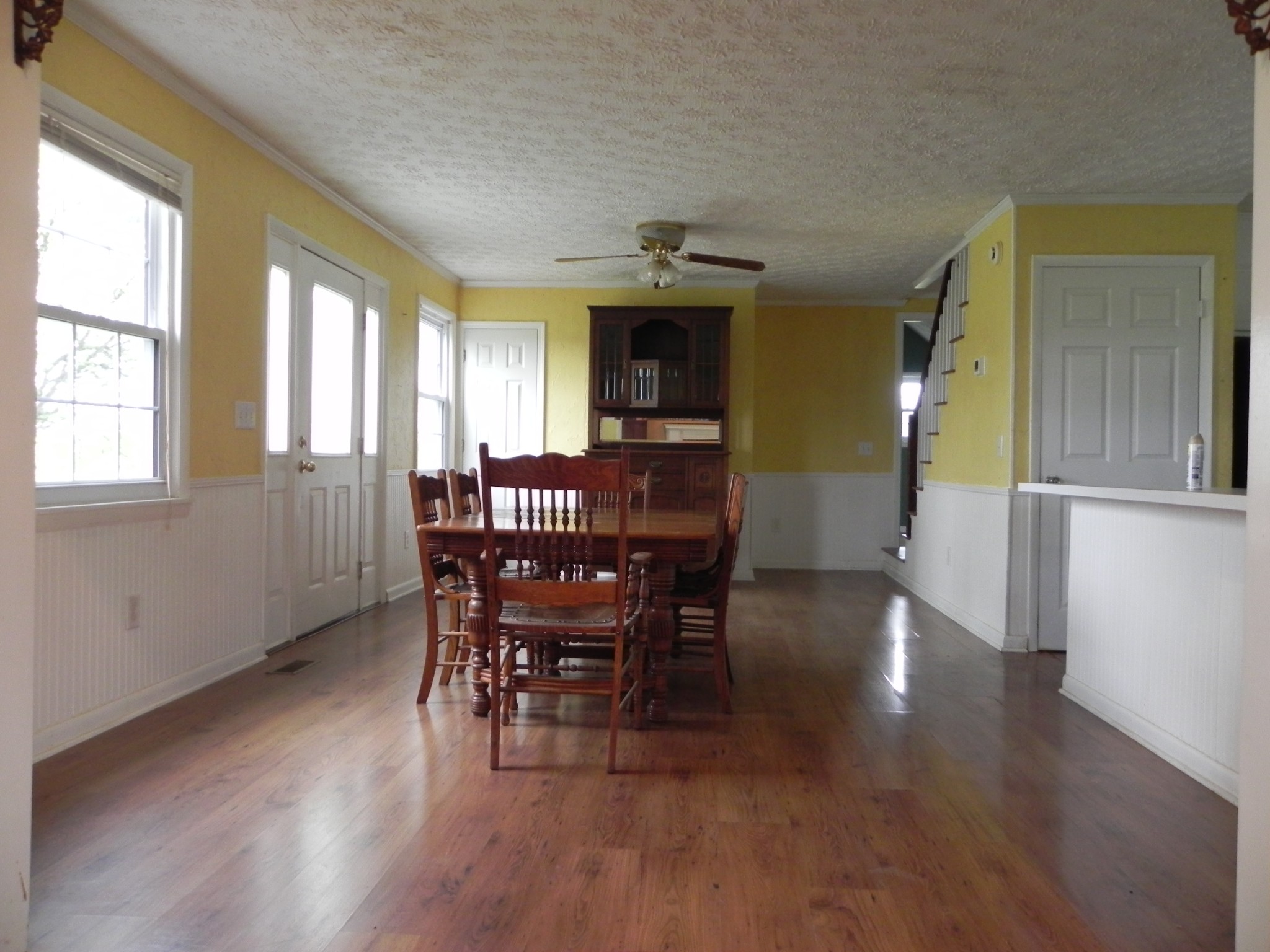 444 Nixon Road Red Boiling Springs, TN 37150 - Photo 7 of 41 a view of a dining room with furniture window and wooden floor