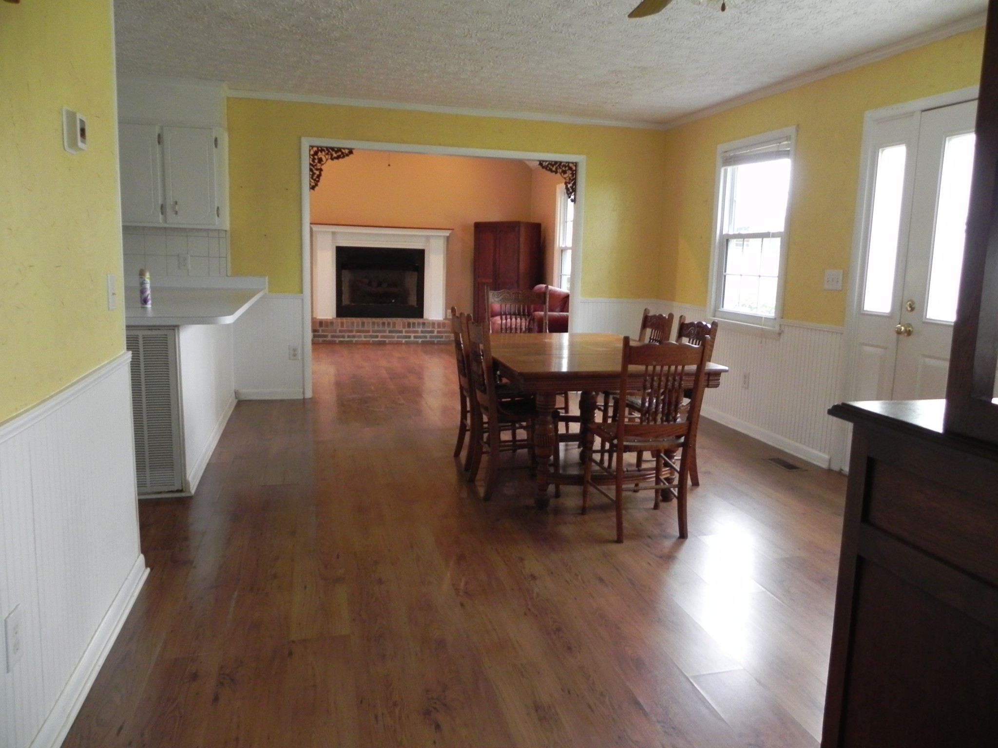 444 Nixon Road Red Boiling Springs, TN 37150 - Photo 8 of 41 a view of a dining room with furniture window and wooden floor