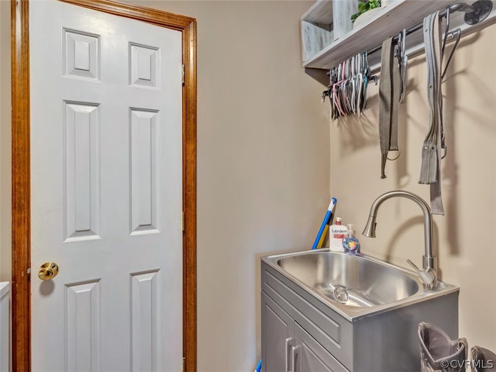 7612 Genuine Risk Lane Midlothian, VA 23112 - Photo 16 of 30 NEW Utility Sink in Laundry Room and Hanging Area.