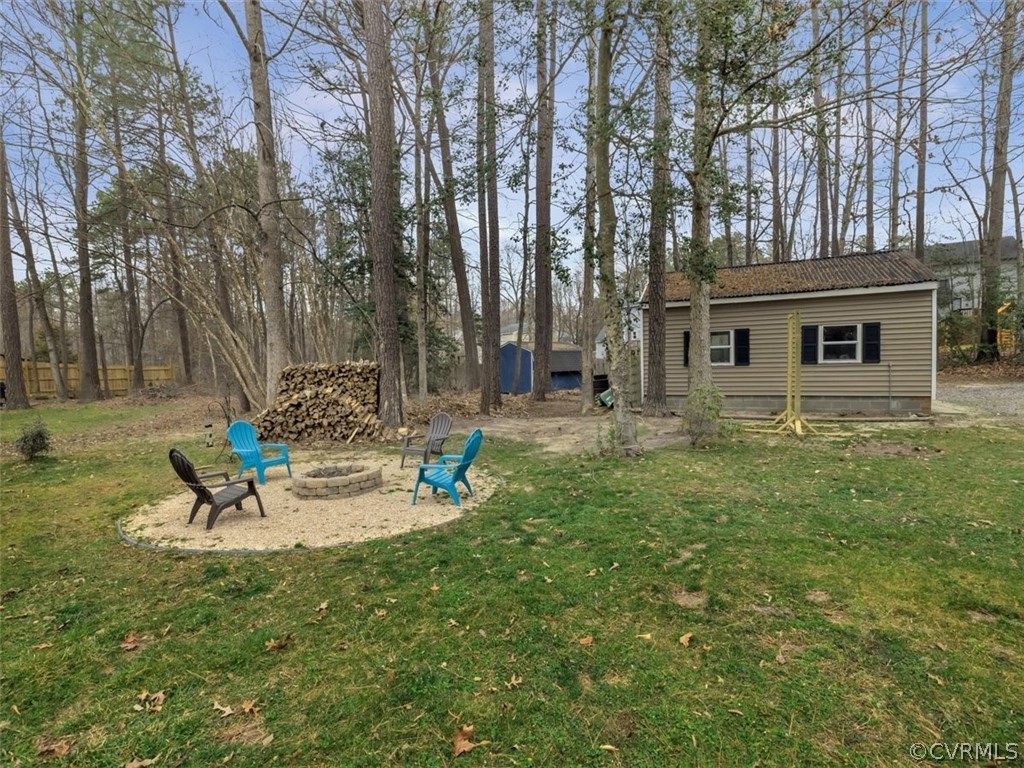 7612 Genuine Risk Lane Midlothian, VA 23112 - Photo 28 of 30 View of Current Firepit Area and Detached Garage.
