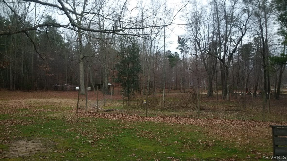 8517 Beach Road Chesterfield, VA 23838 - Photo 16 of 17 a lake view with boat and trees