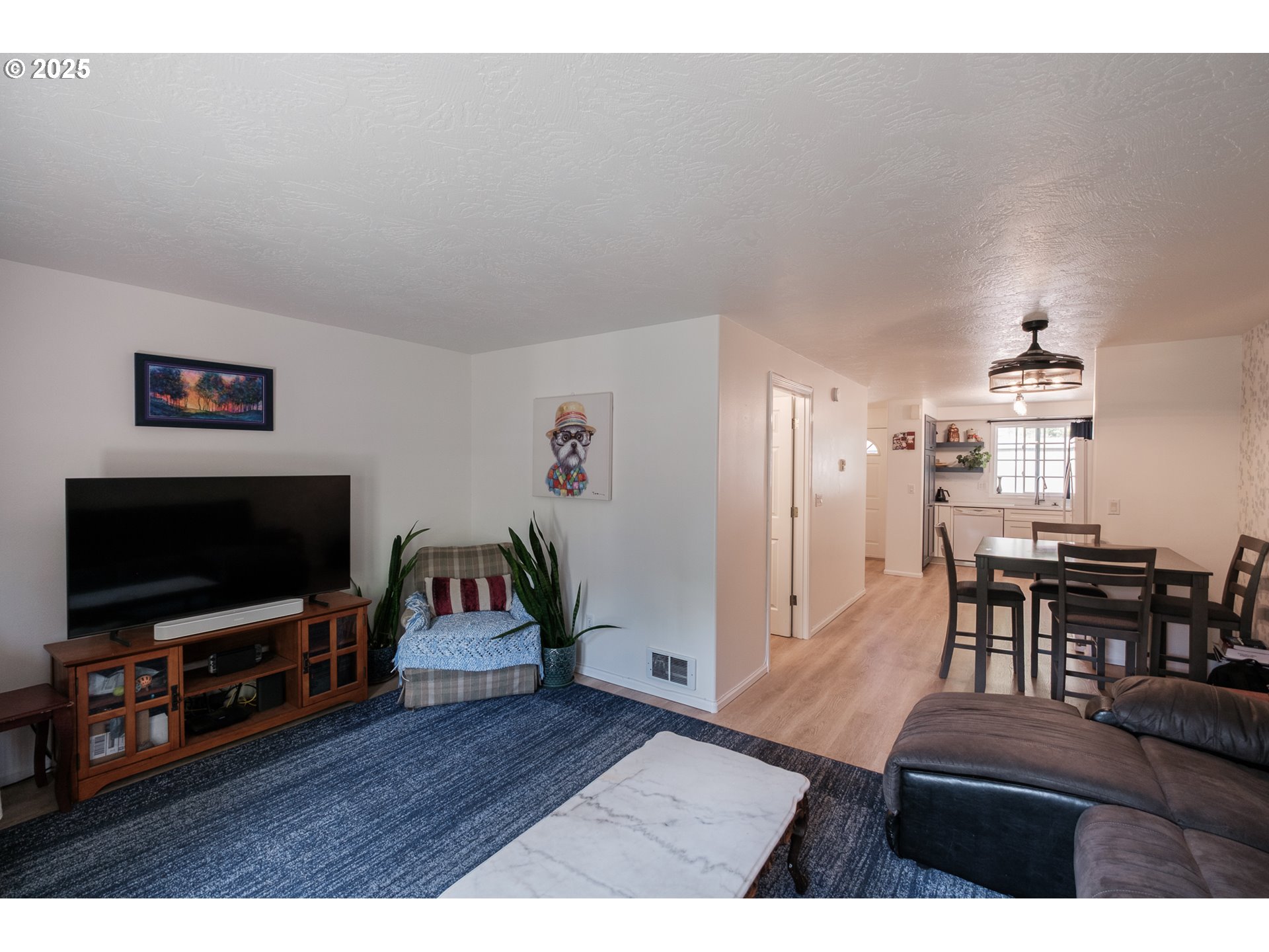 1548 Fetters Loop Eugene, OR 97402 - Photo 13 of 33 a living room with furniture and a flat screen tv