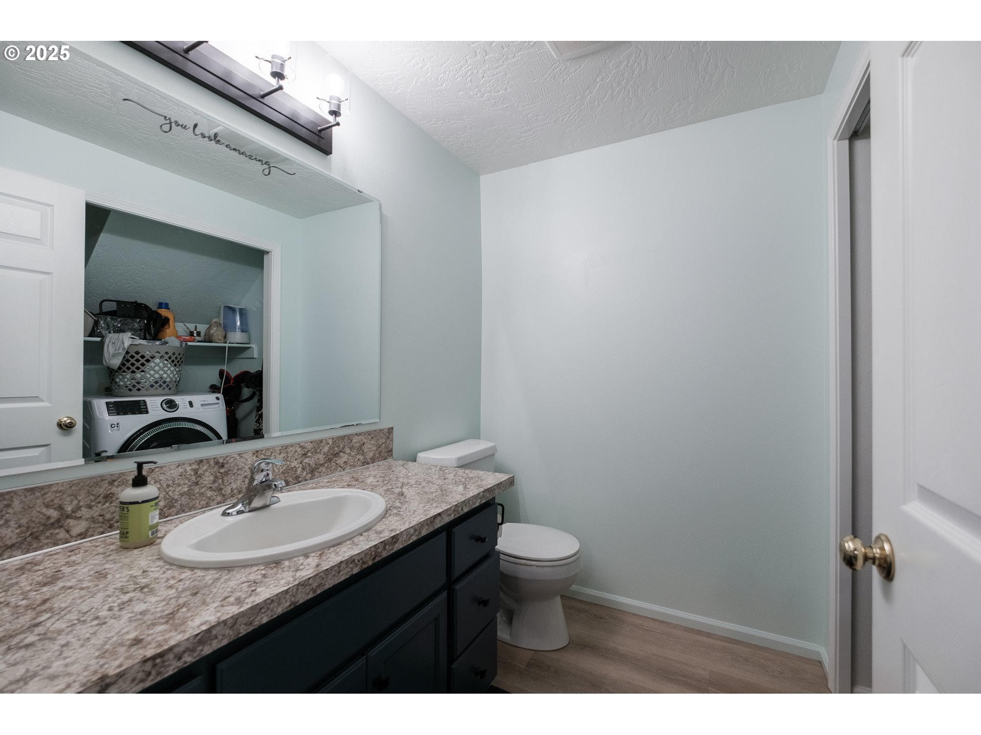 1548 Fetters Loop Eugene, OR 97402 - Photo 14 of 33 a bathroom with a granite countertop sink a toilet and a mirror