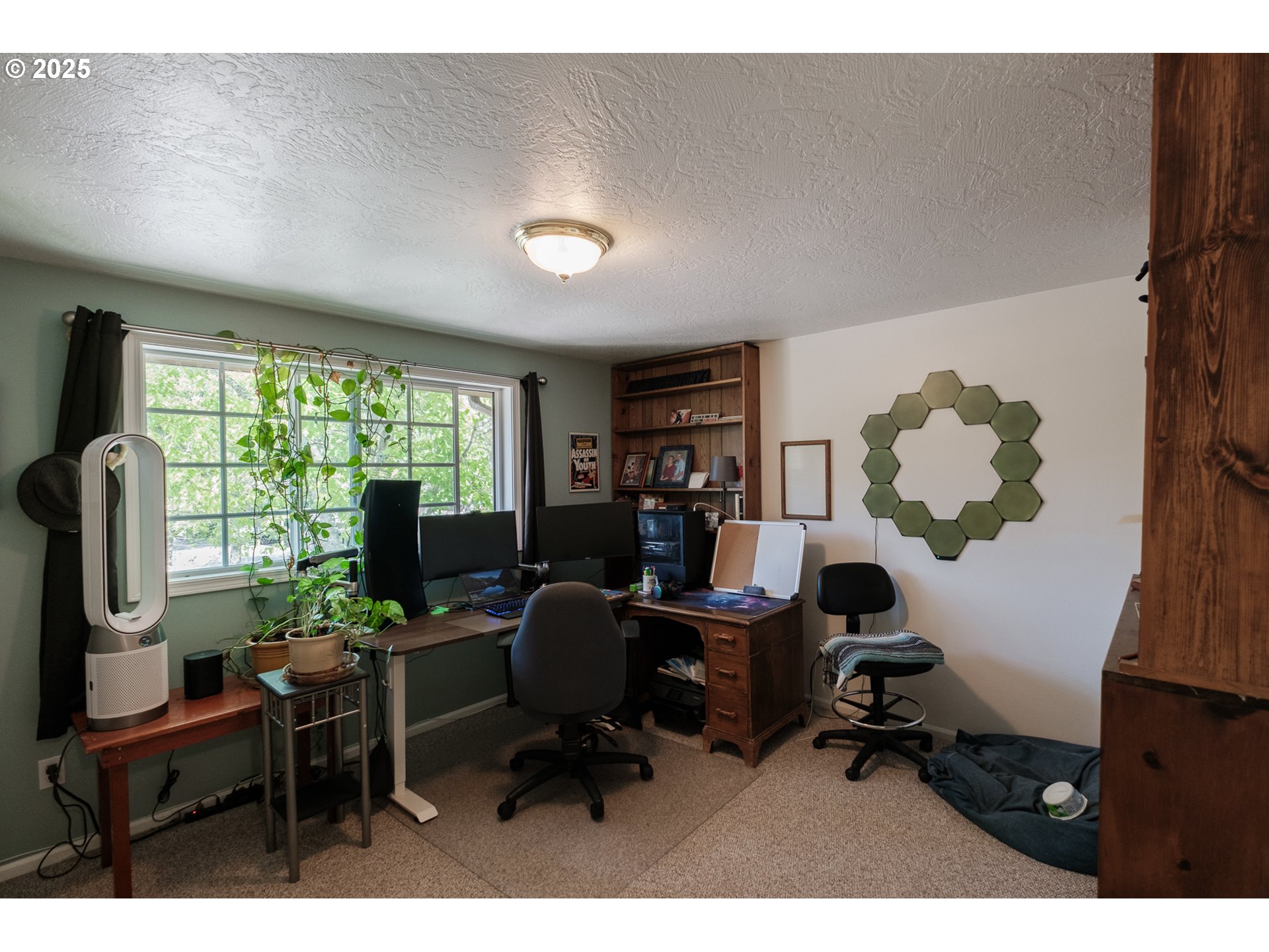 1548 Fetters Loop Eugene, OR 97402 - Photo 18 of 33 a view of a workspace with furniture and a window