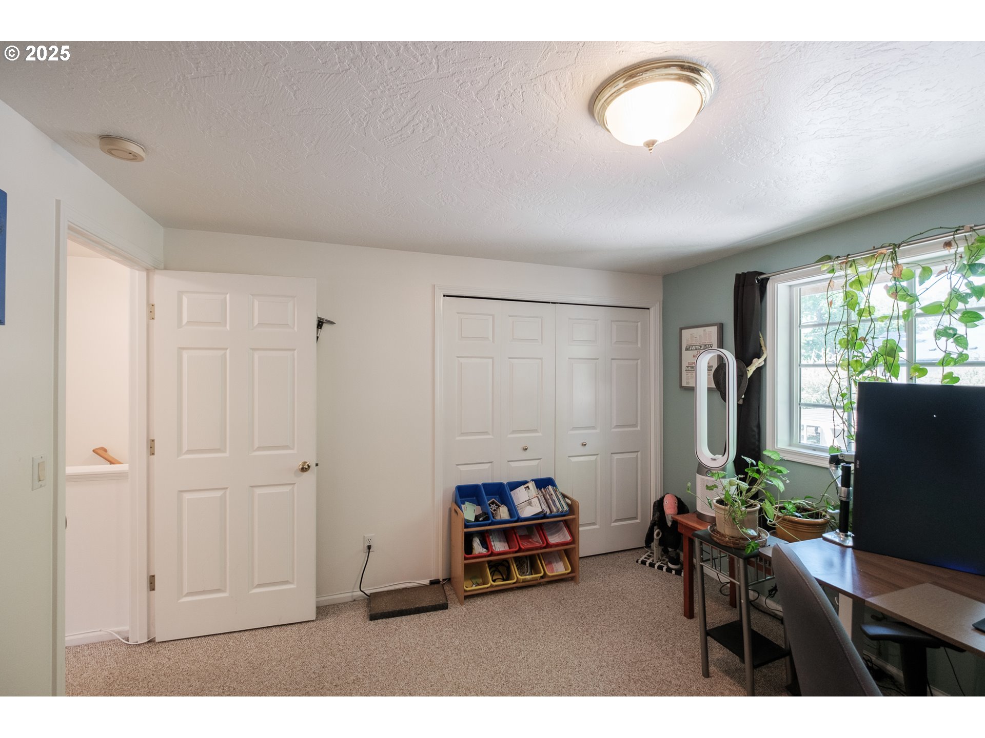 1548 Fetters Loop Eugene, OR 97402 - Photo 20 of 33 a living room with furniture and a flat screen tv
