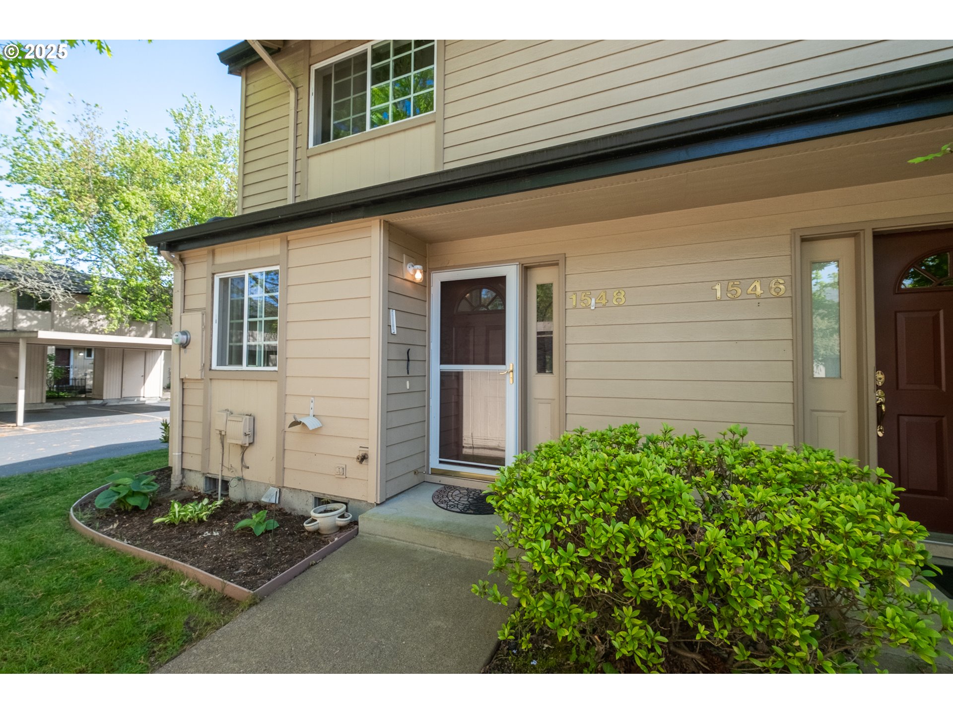 1548 Fetters Loop Eugene, OR 97402 - Photo 2 of 33 a front view of a house with garden