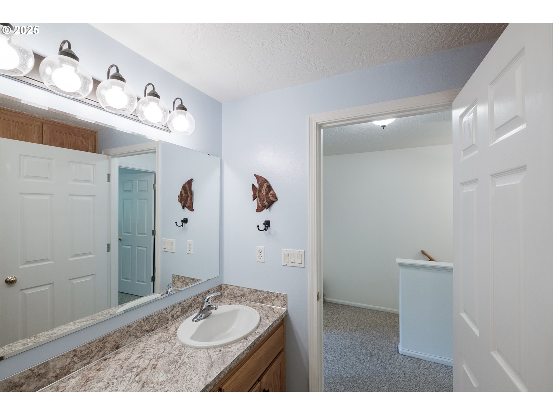1548 Fetters Loop Eugene, OR 97402 - Photo 22 of 33 a bathroom with a granite countertop sink a mirror and shower