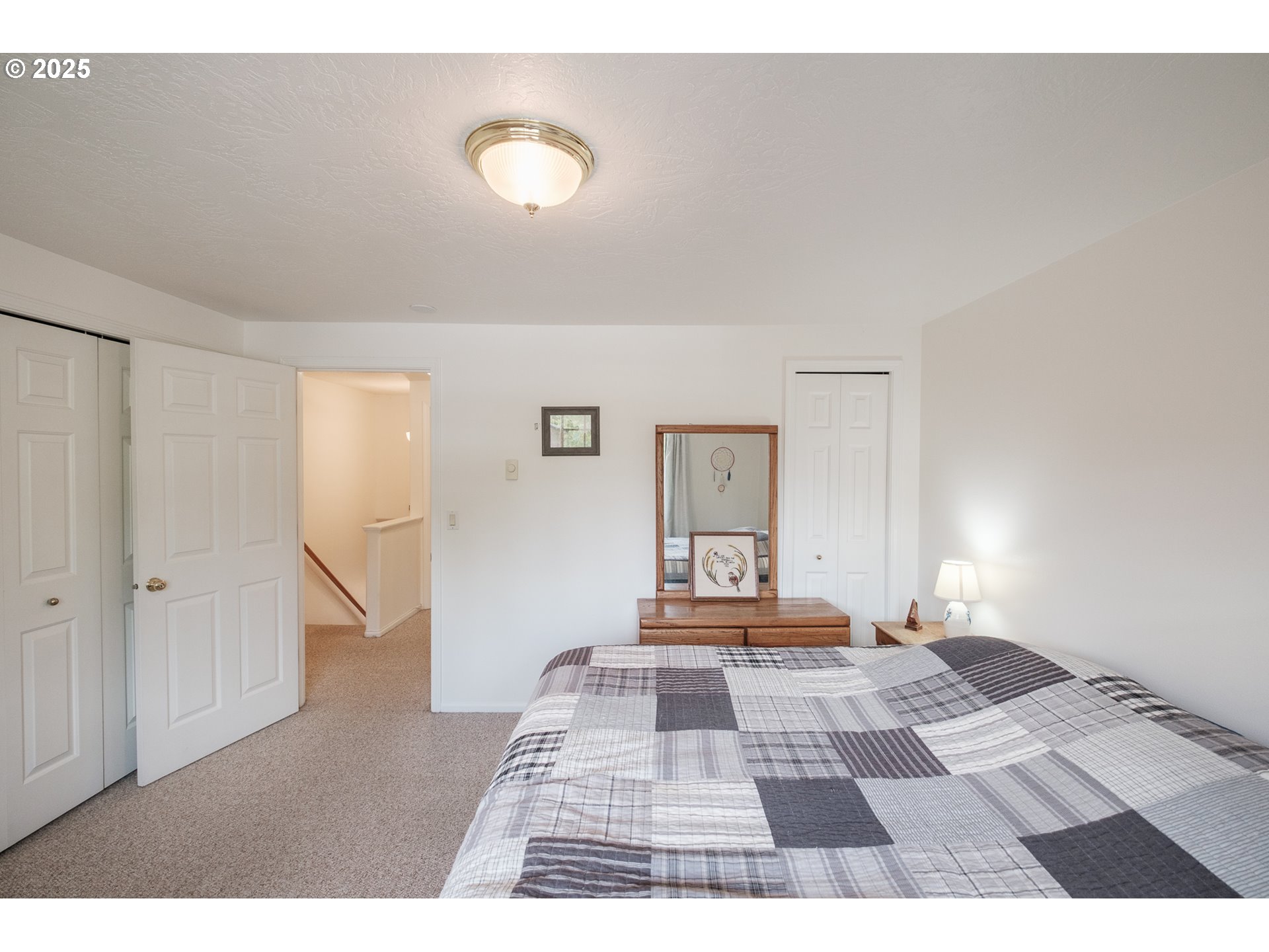 1548 Fetters Loop Eugene, OR 97402 - Photo 23 of 33 a view of a bedroom with wooden floor and bathroom