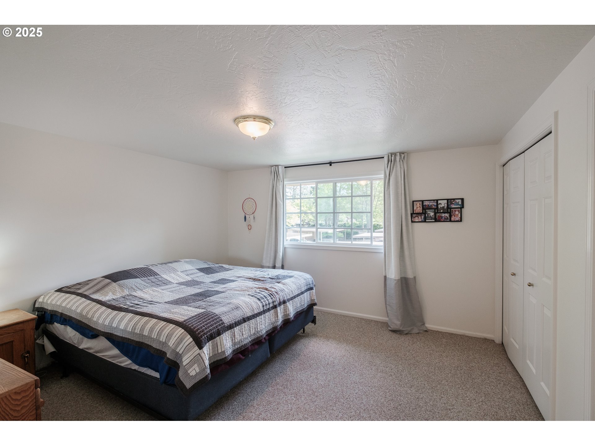 1548 Fetters Loop Eugene, OR 97402 - Photo 24 of 33 a bedroom with a bed and a window